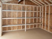 12x16 Custom Peak Storage Shed with overhead door and shelves